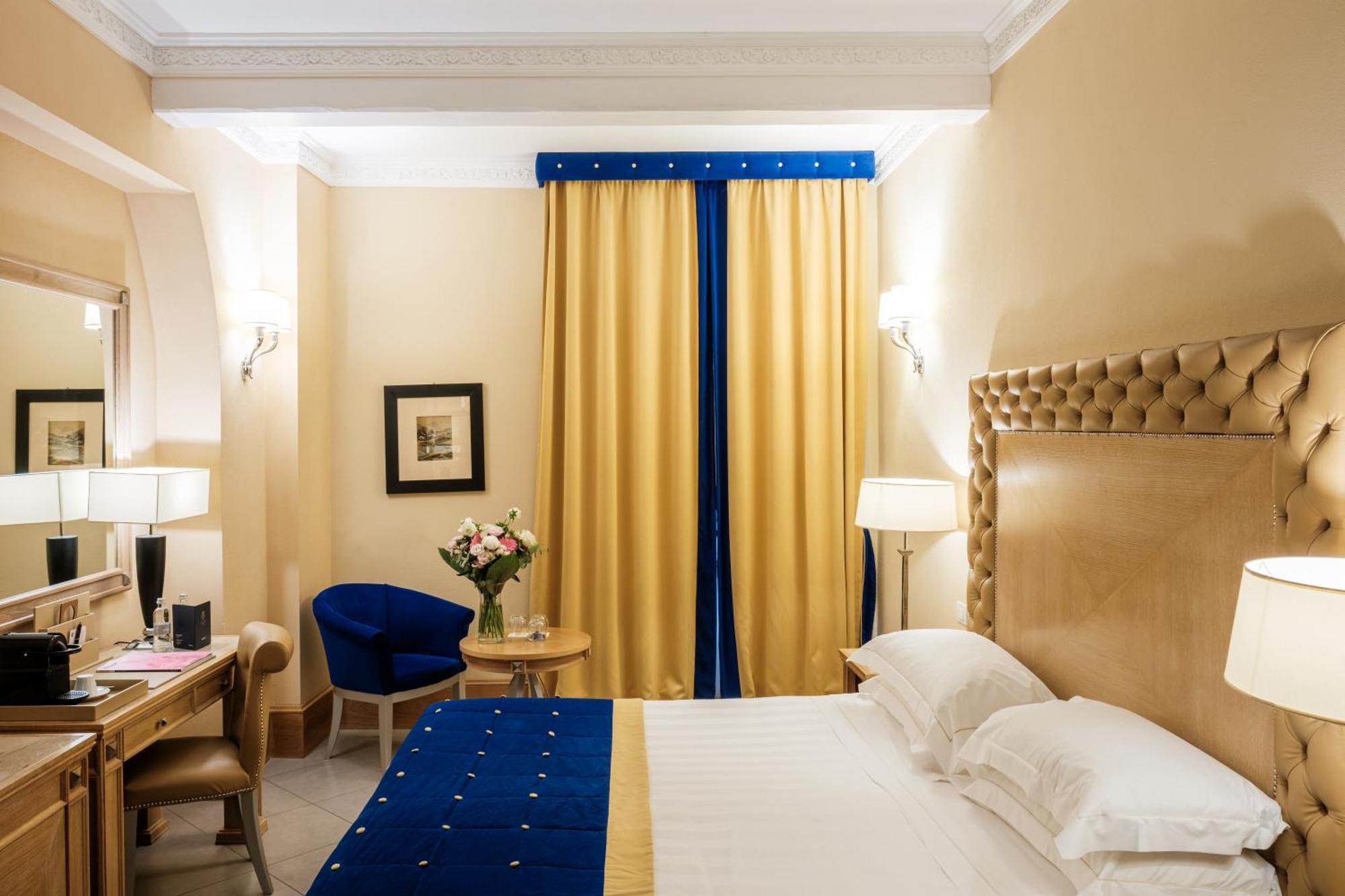 Villa Tolomei Hotel & Resort Florença Exterior foto A room at the hotel